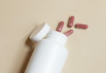 건강한 나를 위한 친구 유산균 a white bottle with red and white pills