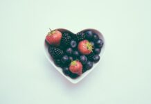 heart-shaped bowl with strawberries