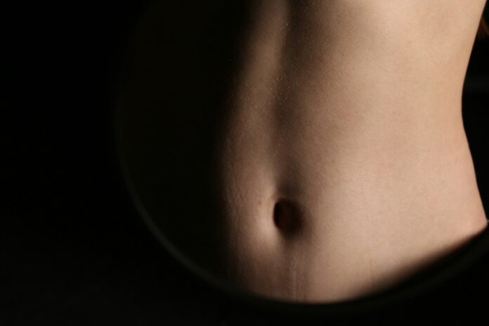 A close-up of a person's abdomen.
