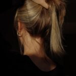 두피부터 모발까지, 일상에서 실천하는 건강한 헤어 관리법 a woman with her hair in a bun