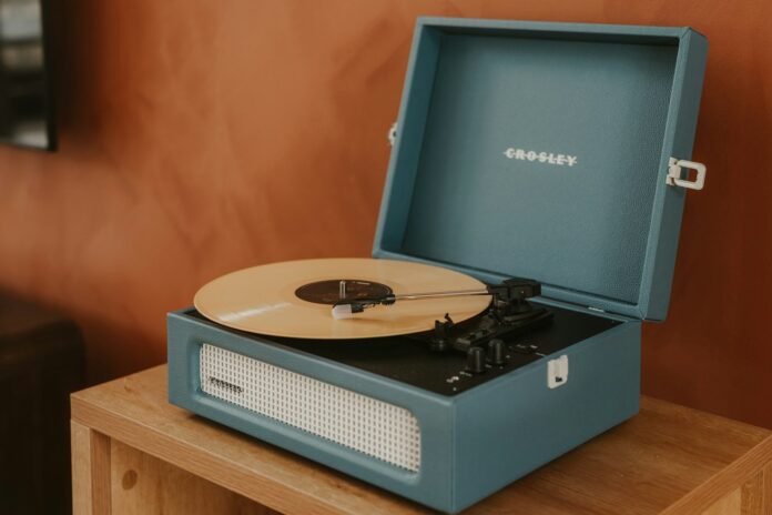 A blue record player with a record on it.